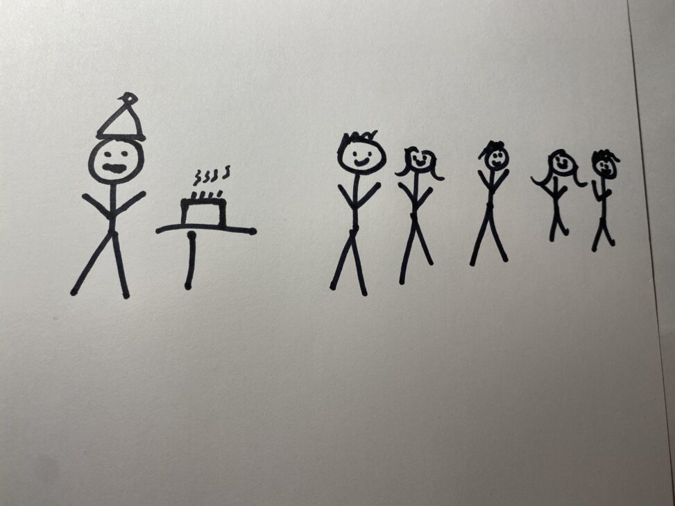 Stick version self of me at my birthday while everyone is singing happy birthday to me.
